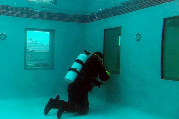 Diver Working in Pool